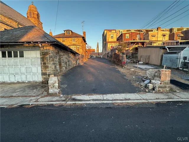 a view of a street with cars