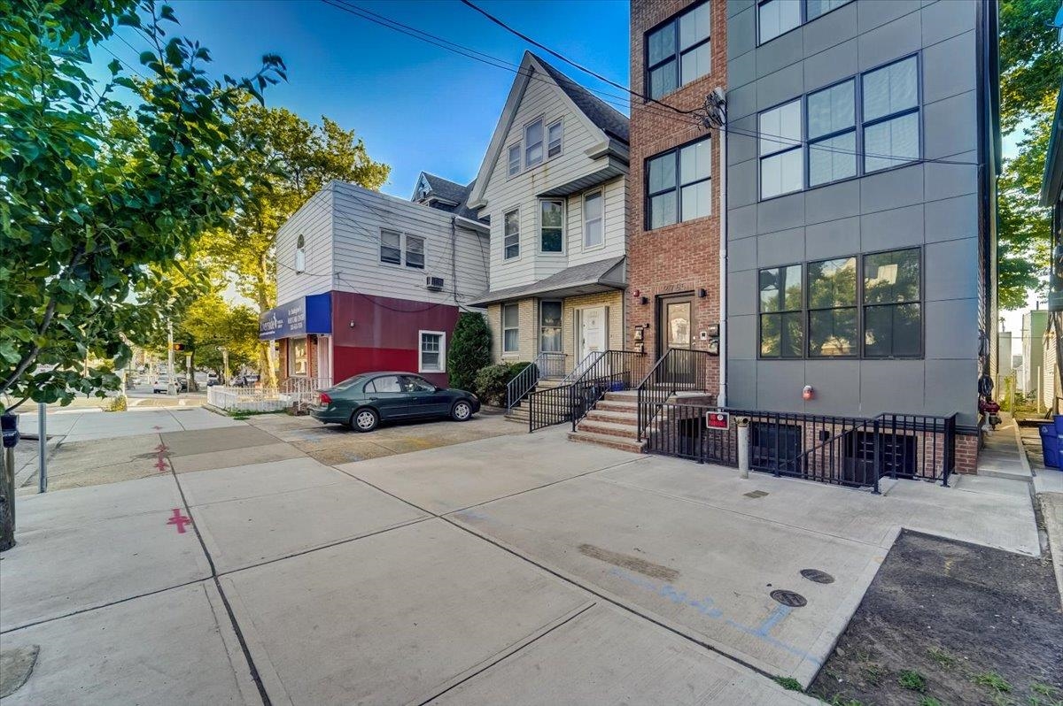2765 John F. Kennedy Boulevard, Unit 1 Jersey City, NJ 07306 - Photo 1 of 33 a view of a building with a sitting area