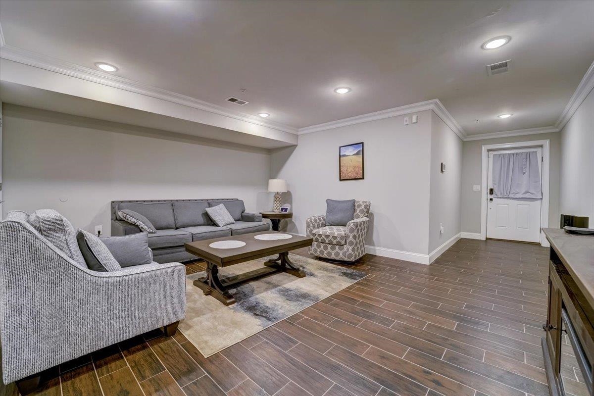 2765 John F. Kennedy Boulevard, Unit 1 Jersey City, NJ 07306 - Photo 4 of 33 a living room with furniture and wooden floor
