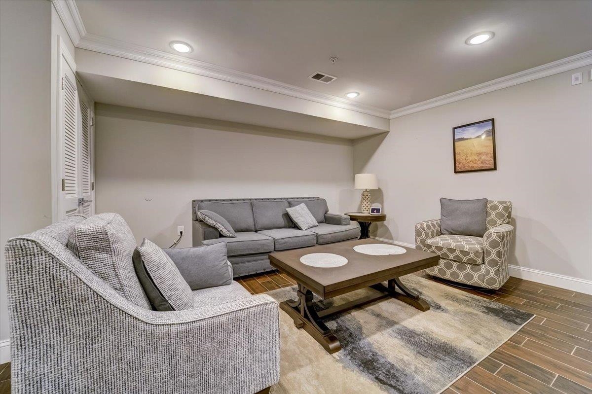 2765 John F. Kennedy Boulevard, Unit 1 Jersey City, NJ 07306 - Photo 6 of 33 a living room with furniture and a rug