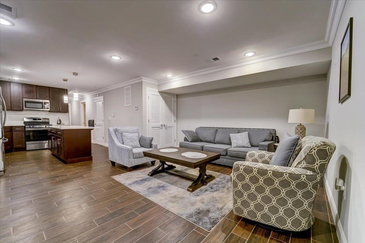 2765 John F. Kennedy Boulevard, Unit 1 Jersey City, NJ 07306 - Photo 7 of 33 a living room with furniture and a wooden floor