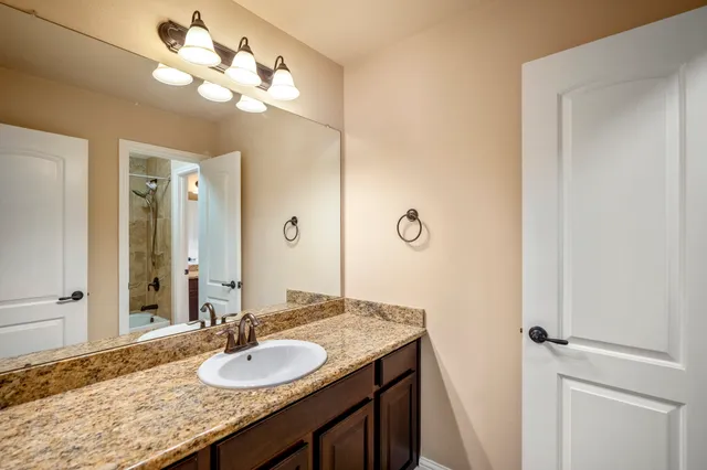 an empty room with a empty space and a ceiling fan