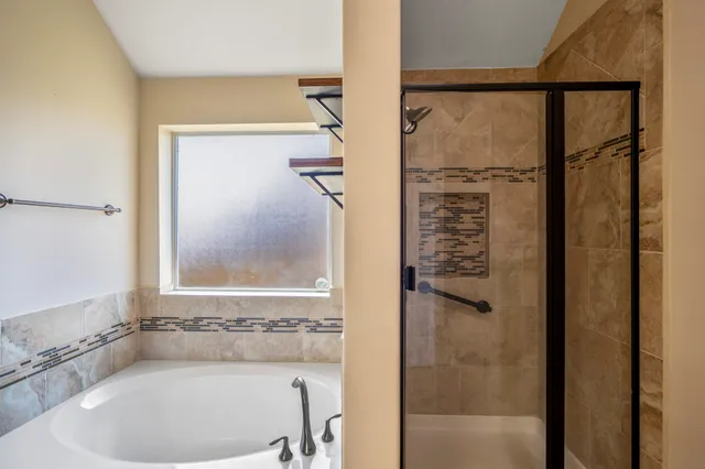 a bathroom with a granite countertop sink a mirror and a vanity