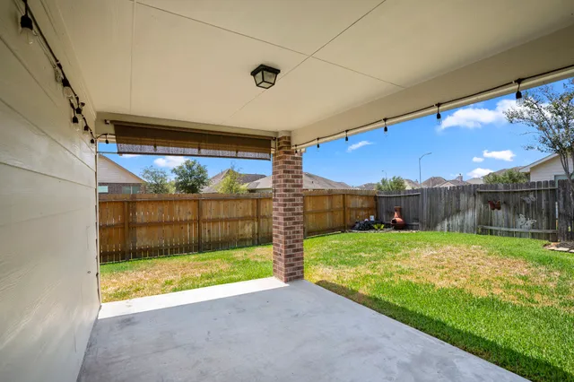 a front view of house with a garden