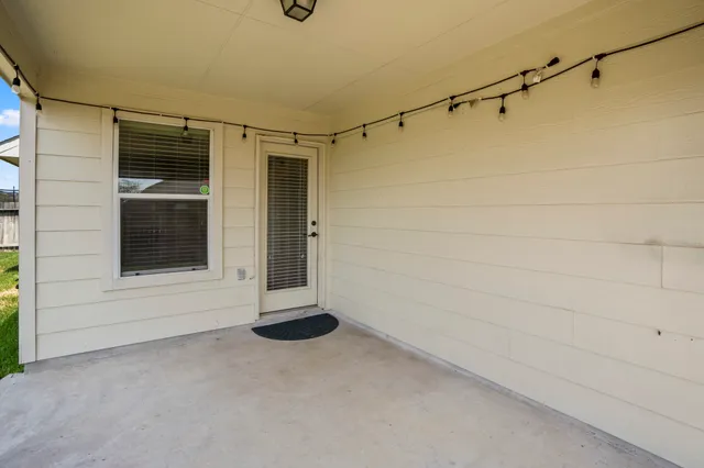 a front view of house with yard and trees
