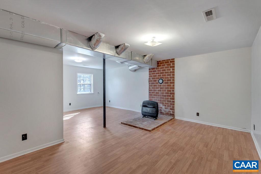 3299 Rabbit Valley Road North Garden, VA 22959 - Photo 29 of 43 a view of empty room with wooden floor and fan
