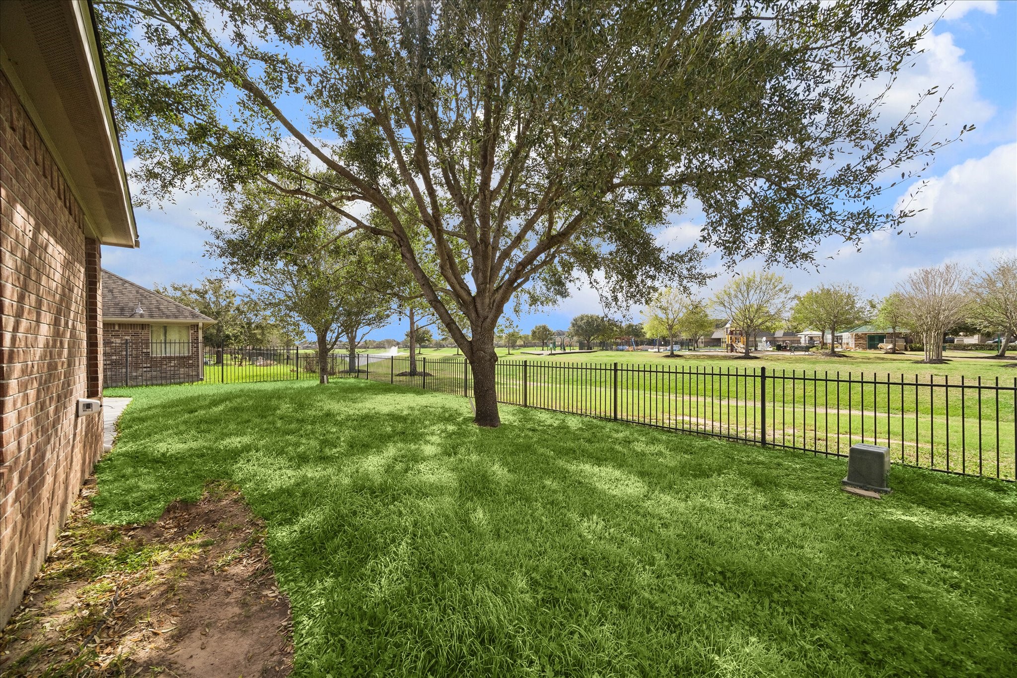 7806 Summer Night Lane Rosenberg, TX 77469 - Photo 21 of 23 Relaxing backyard with mature trees providing shade and a fenced lawn offering space to unwind or enjoy outdoor activities.