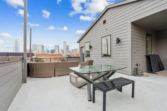 a living room with a table and chairs