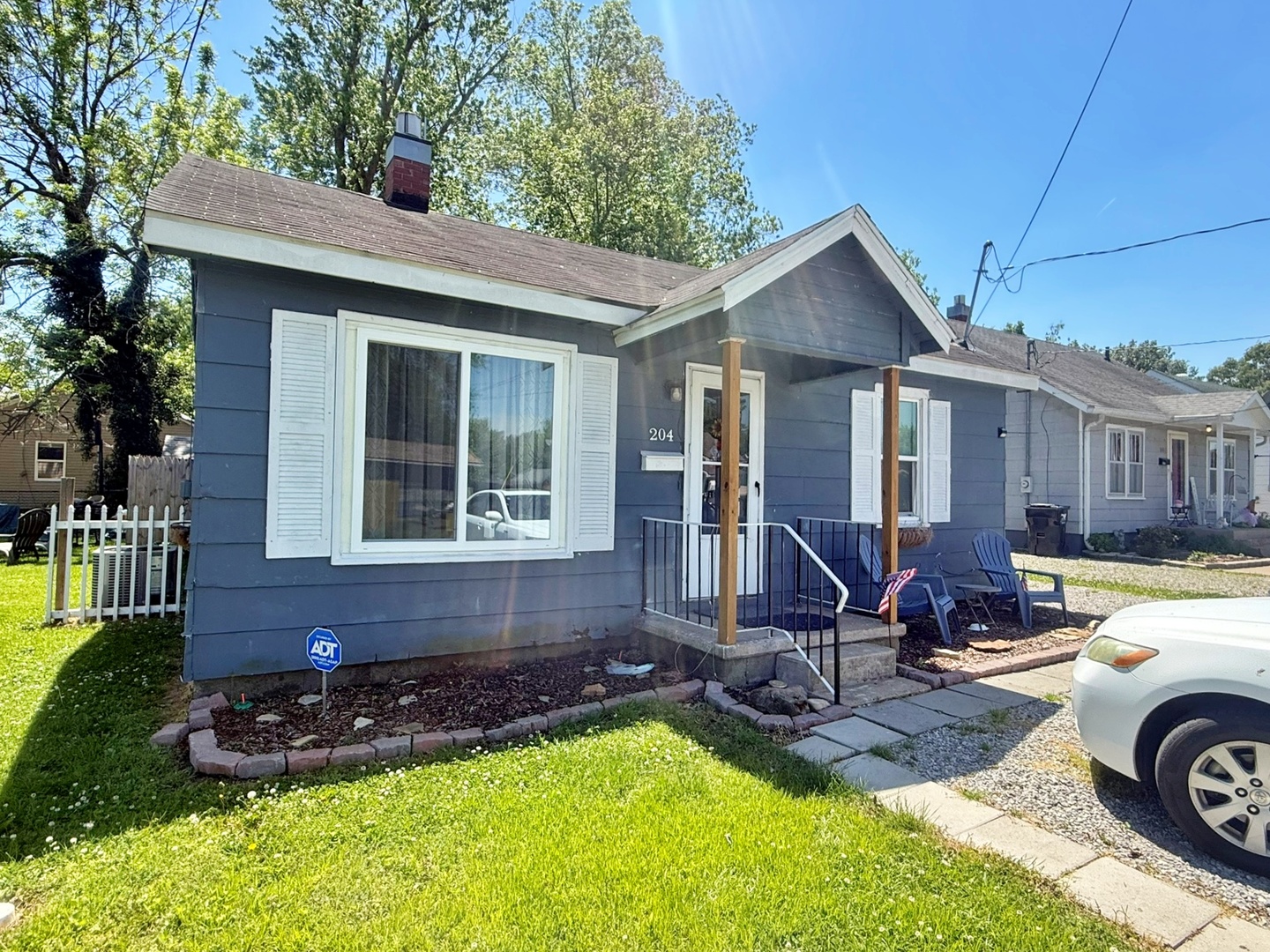 204 West 18th Street Metropolis, IL 62960 - Photo 1 of 12 a front view of a house with a yard table and chairs