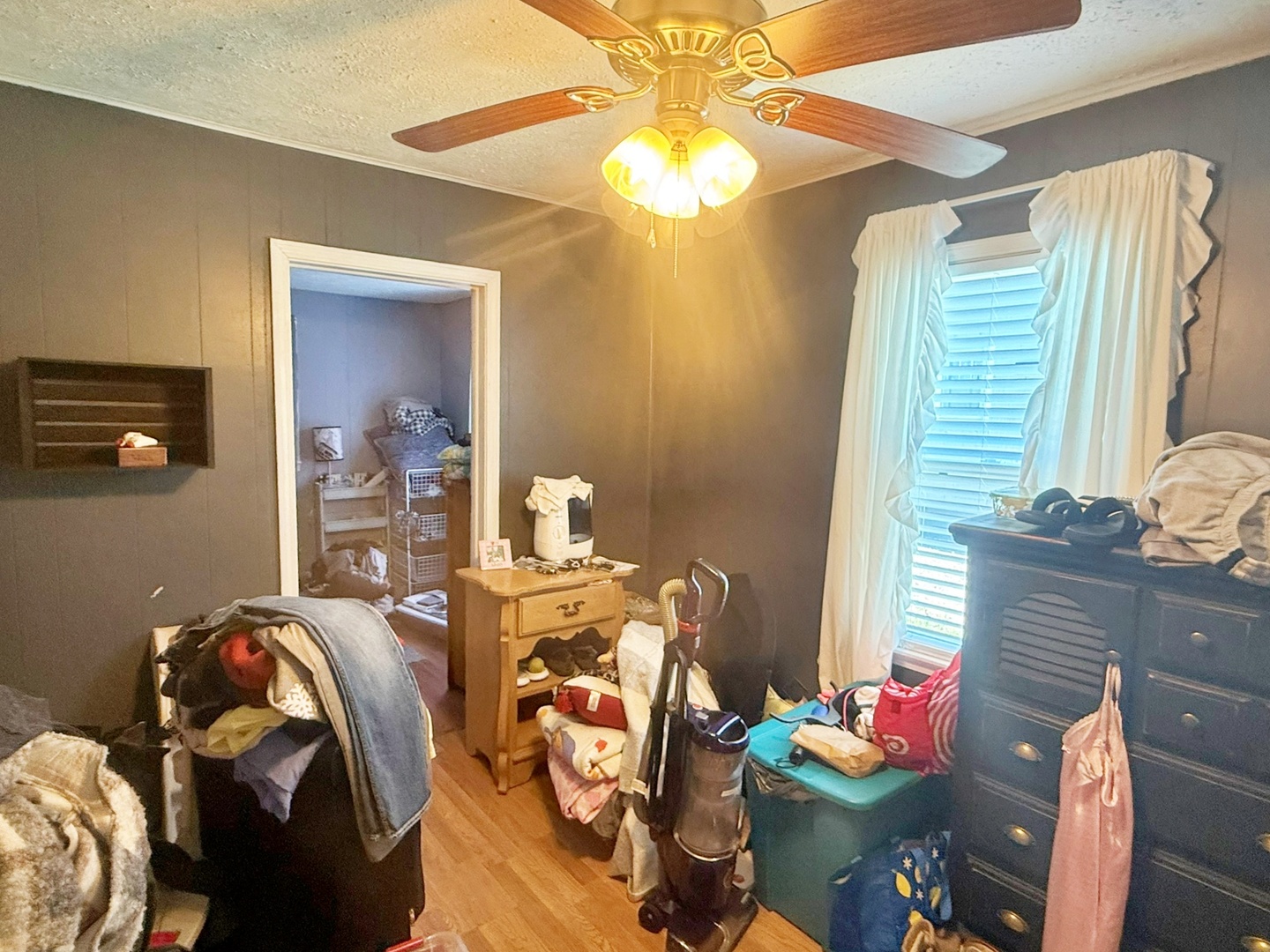 204 West 18th Street Metropolis, IL 62960 - Photo 8 of 12 a bedroom with a bed and a chandelier