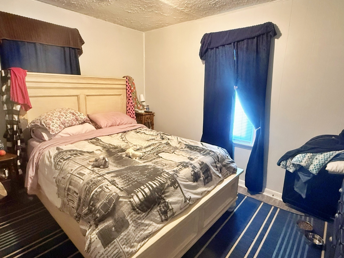 204 West 18th Street Metropolis, IL 62960 - Photo 9 of 12 a bedroom with a bed and wooden floor