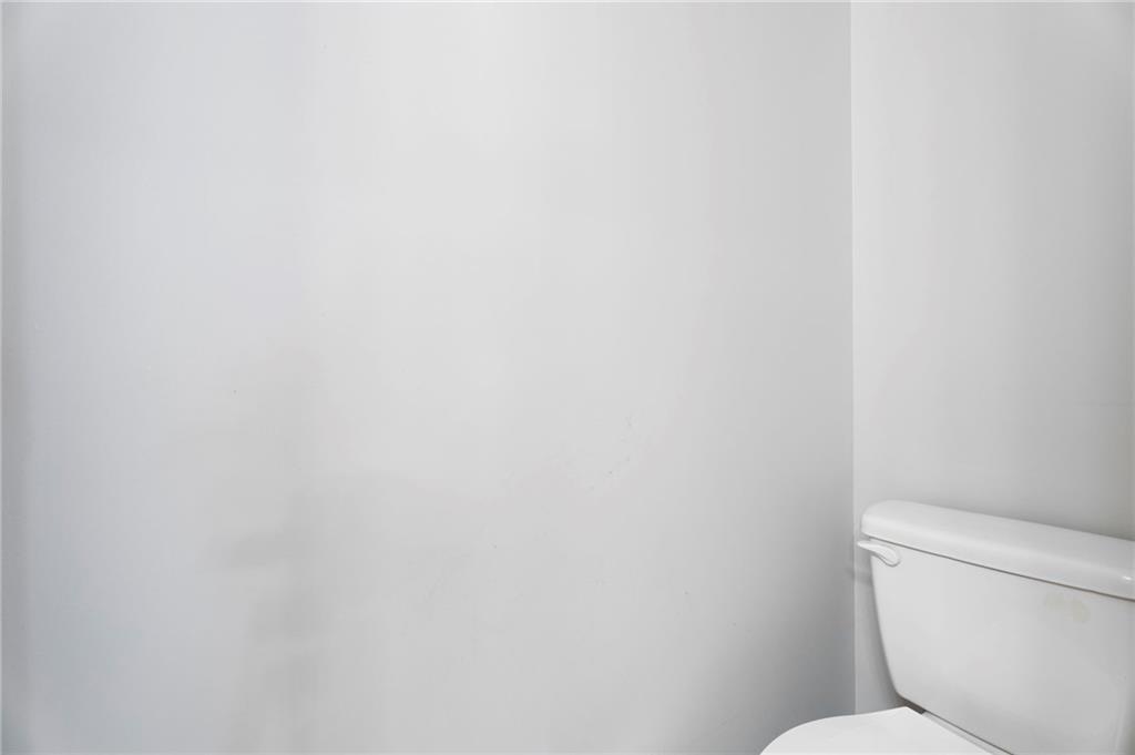 6854 John West Road Winston, GA 30187 - Photo 13 of 46 a white toilet sitting next to a white wall