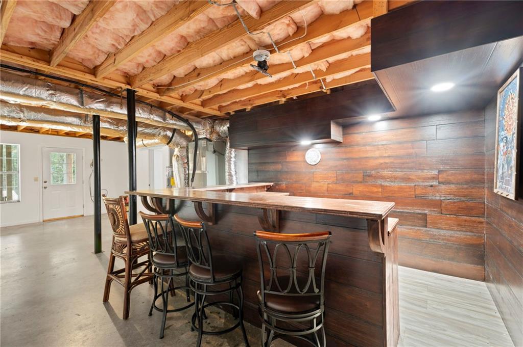 6854 John West Road Winston, GA 30187 - Photo 29 of 46 a view of a dining room with furniture and wooden floor