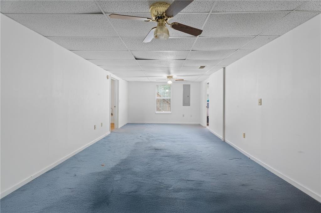 6854 John West Road Winston, GA 30187 - Photo 34 of 46 en empty room with chandelier fan and window