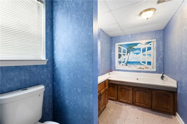 a room with a table and a toilet