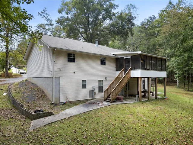 a view of a small house in the back yard