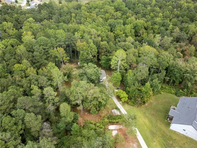 an aerial view of residential house with outdoor space