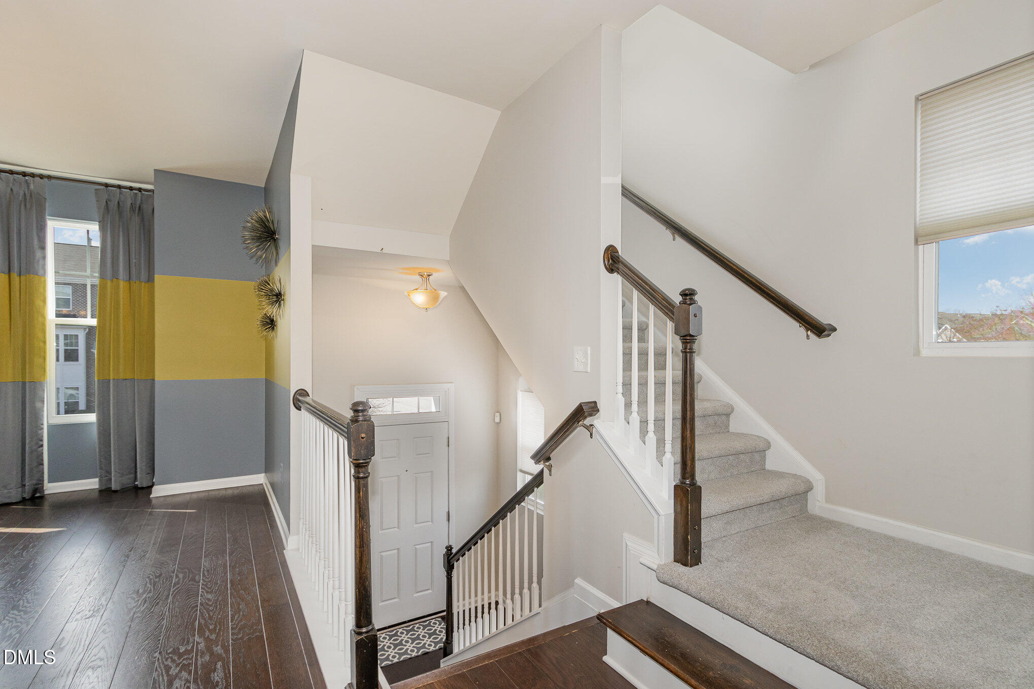 9142 Falkwood Road Raleigh, NC 27617 - Photo 14 of 33 a view of staircase with lots of frames and stairs