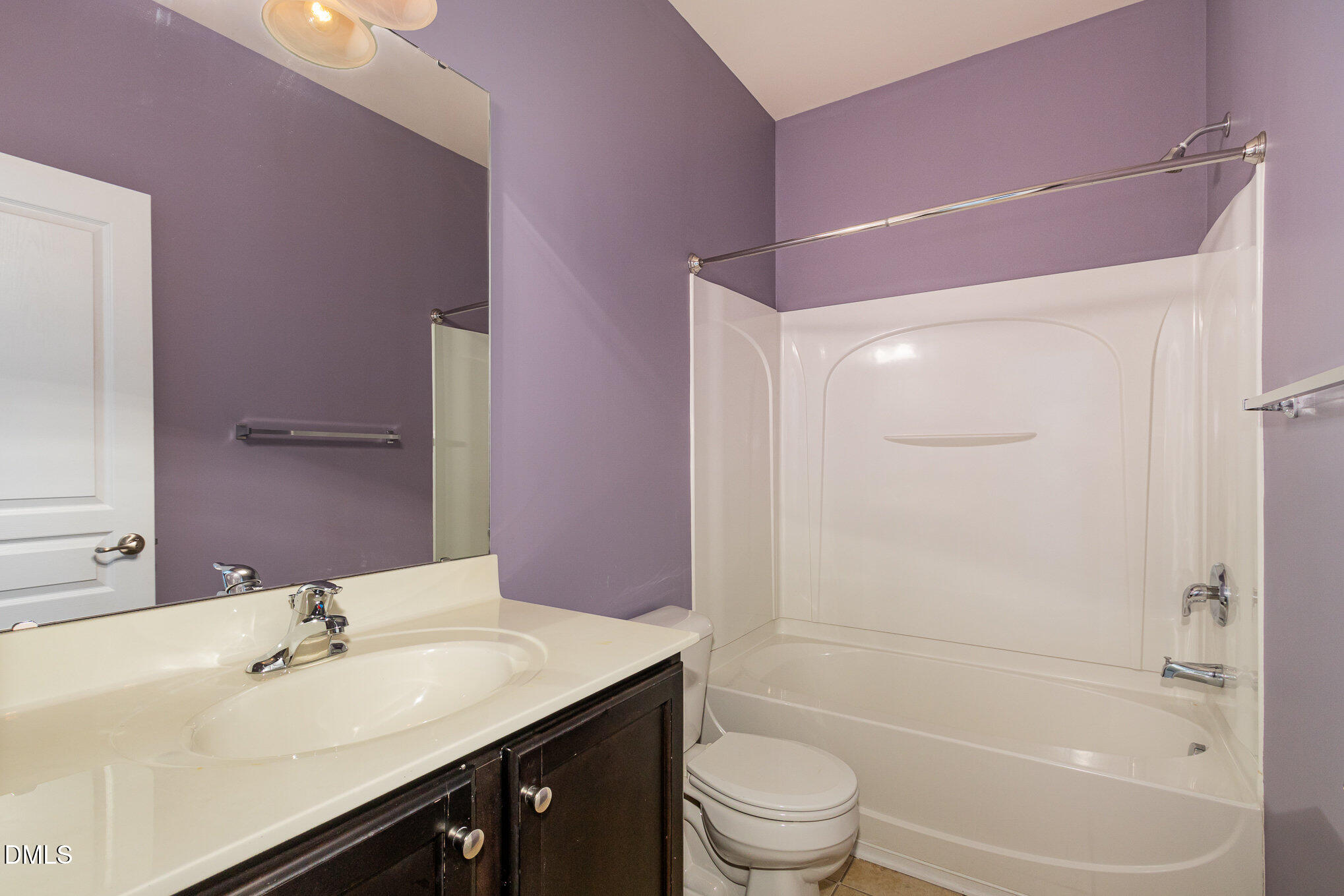 9142 Falkwood Road Raleigh, NC 27617 - Photo 25 of 33 a bathroom with a sink a toilet and shower