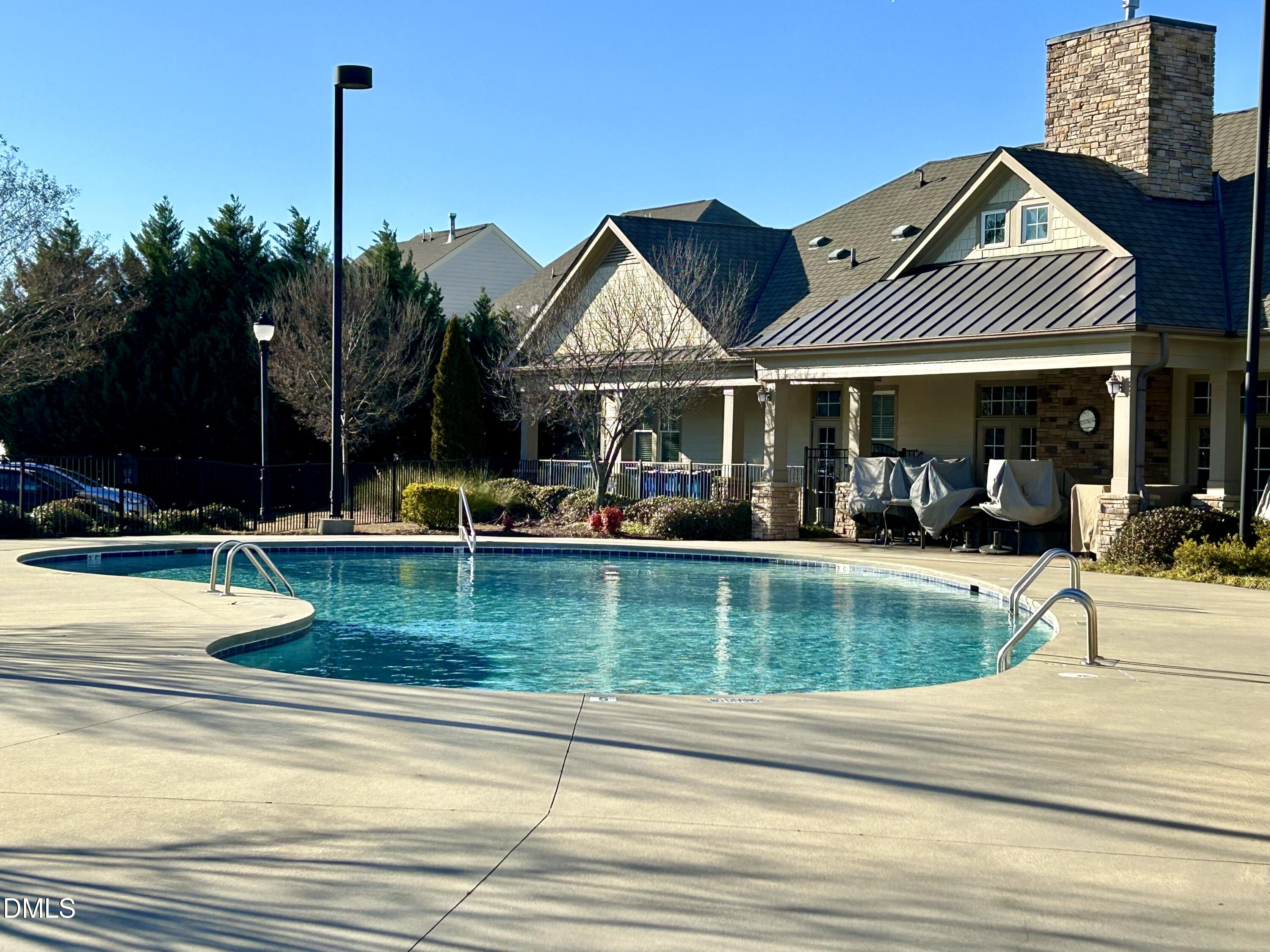 9142 Falkwood Road Raleigh, NC 27617 - Photo 29 of 33 a view of a house with a swimming pool