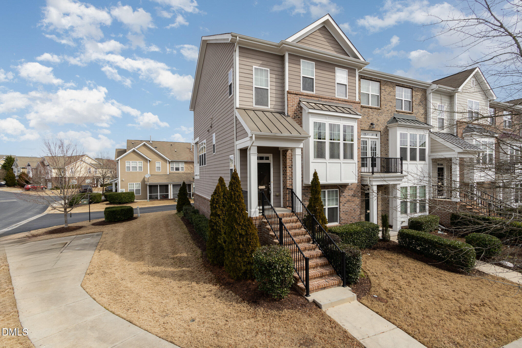 9142 Falkwood Road Raleigh, NC 27617 - Photo 3 of 33 a front view of a residential apartment building with a yard