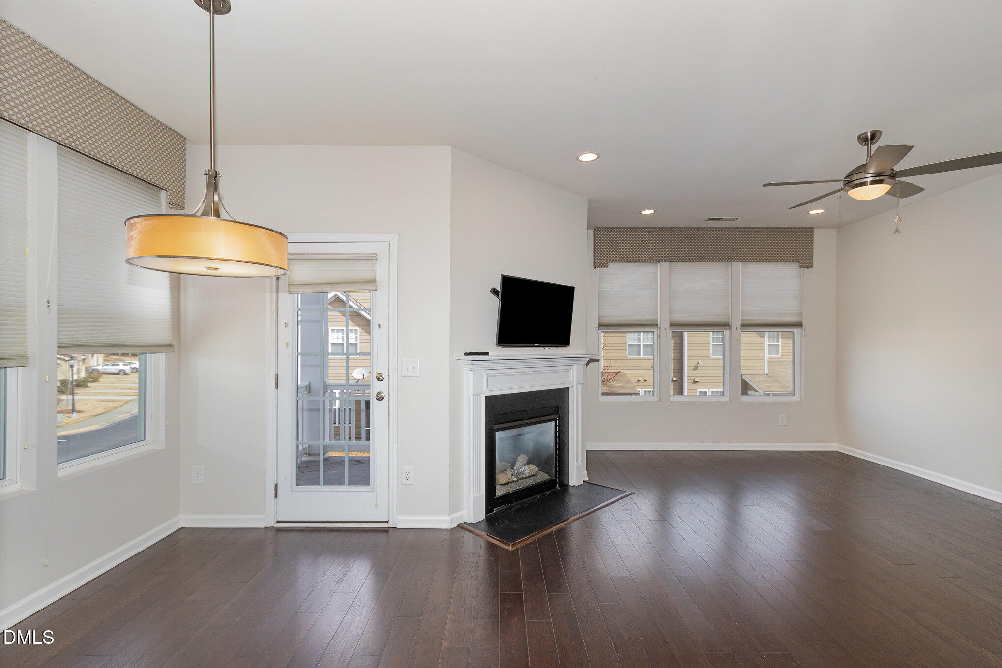 9142 Falkwood Road Raleigh, NC 27617 - Photo 4 of 33 a view of livingroom with furniture wooden floor and window