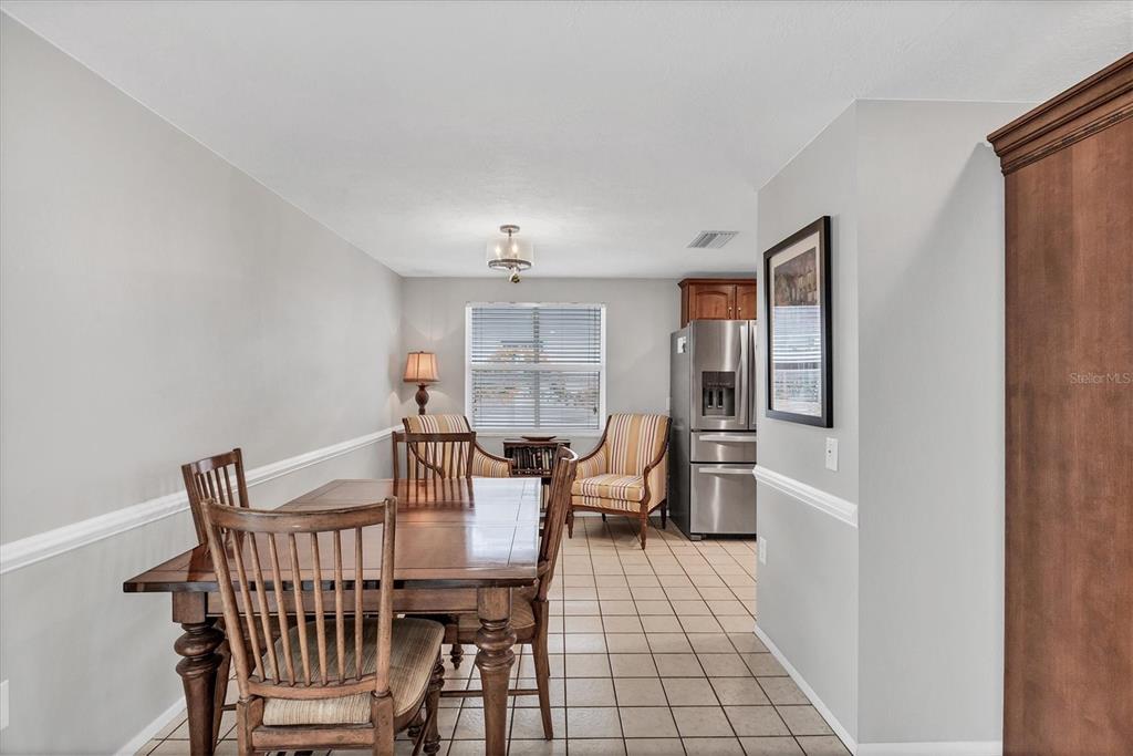 1456 Strada D Argento Venice, FL 34292 - Photo 11 of 47 a view of a dining room with furniture