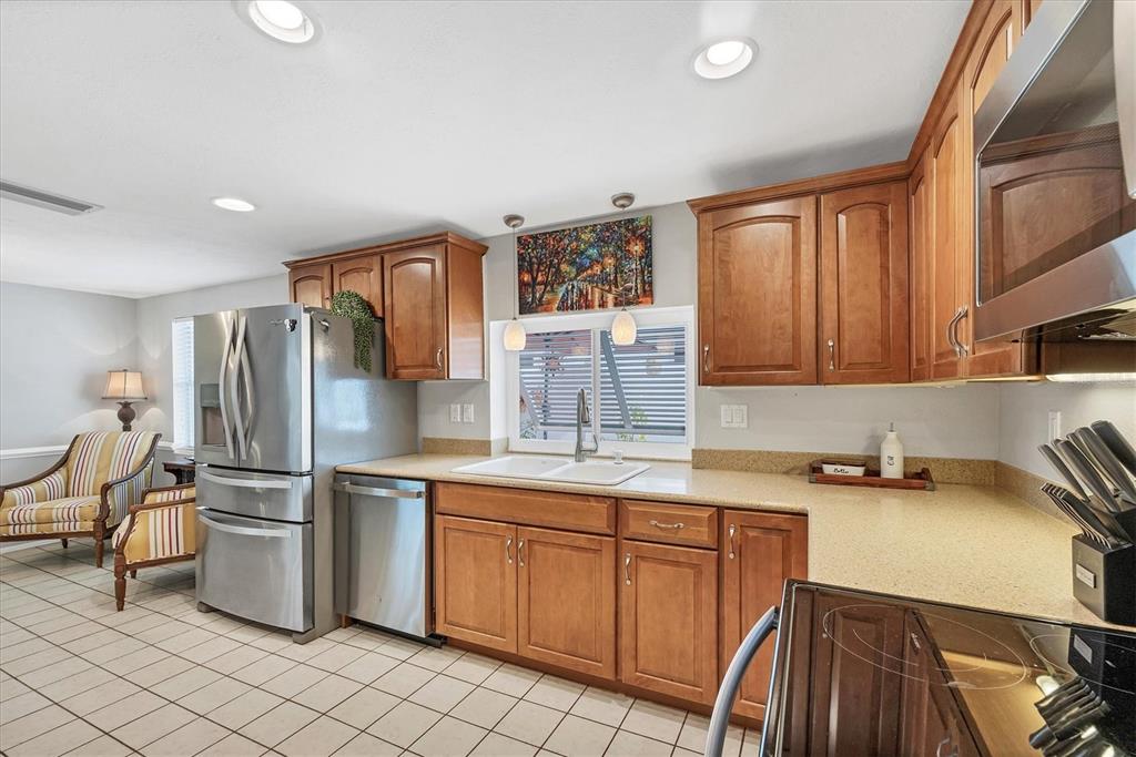 1456 Strada D Argento Venice, FL 34292 - Photo 12 of 47 a kitchen with a sink appliances and cabinets