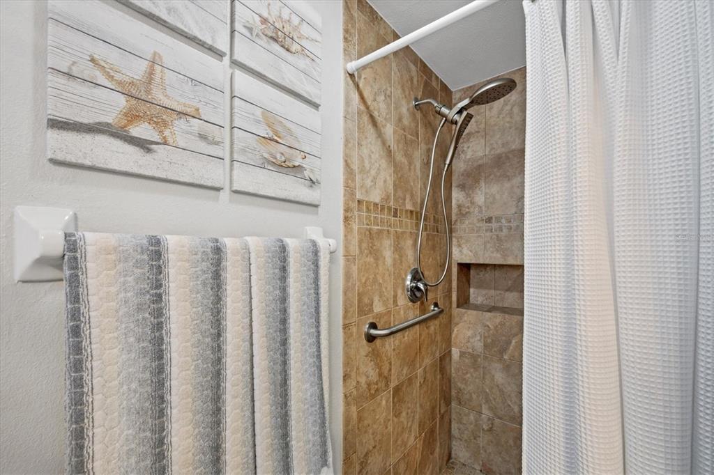 1456 Strada D Argento Venice, FL 34292 - Photo 18 of 47 a bathroom with a shower