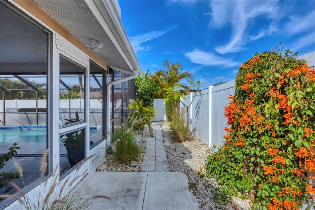 1456 Strada D Argento Venice, FL 34292 - Photo 25 of 47 a front view of a house with a yard