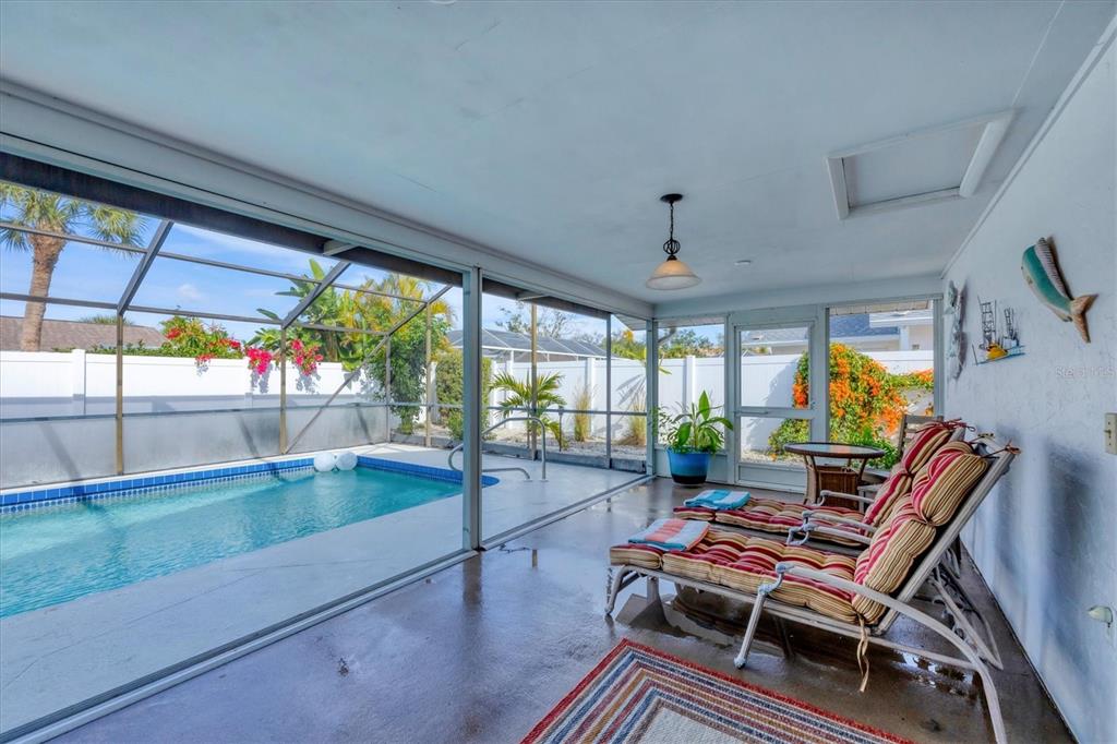 1456 Strada D Argento Venice, FL 34292 - Photo 26 of 47 a room with furniture and a floor to ceiling window