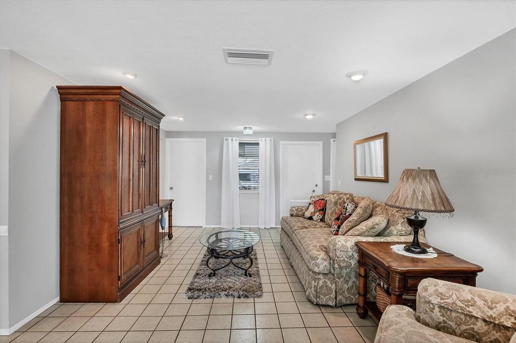 1456 Strada D Argento Venice, FL 34292 - Photo 6 of 47 a living room with furniture and a lamp