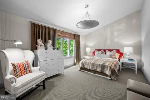 a bedroom with furniture and a window