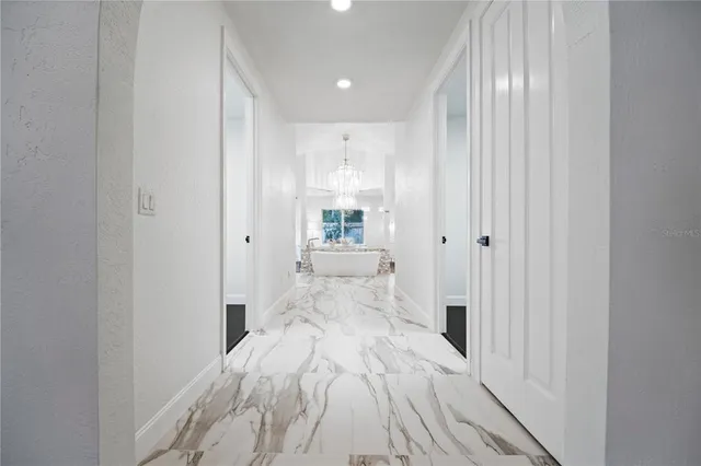 a bathroom with a granite countertop sink a mirror and a toilet