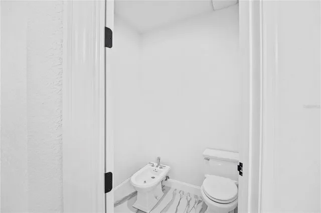 a view of a swimming pool with a yard