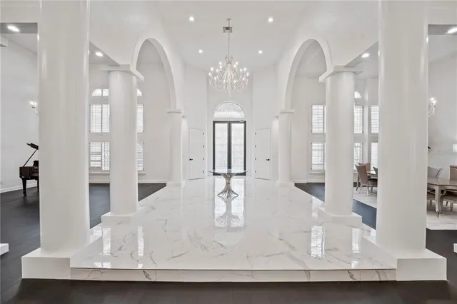 a living room with fireplace furniture and a wooden floor