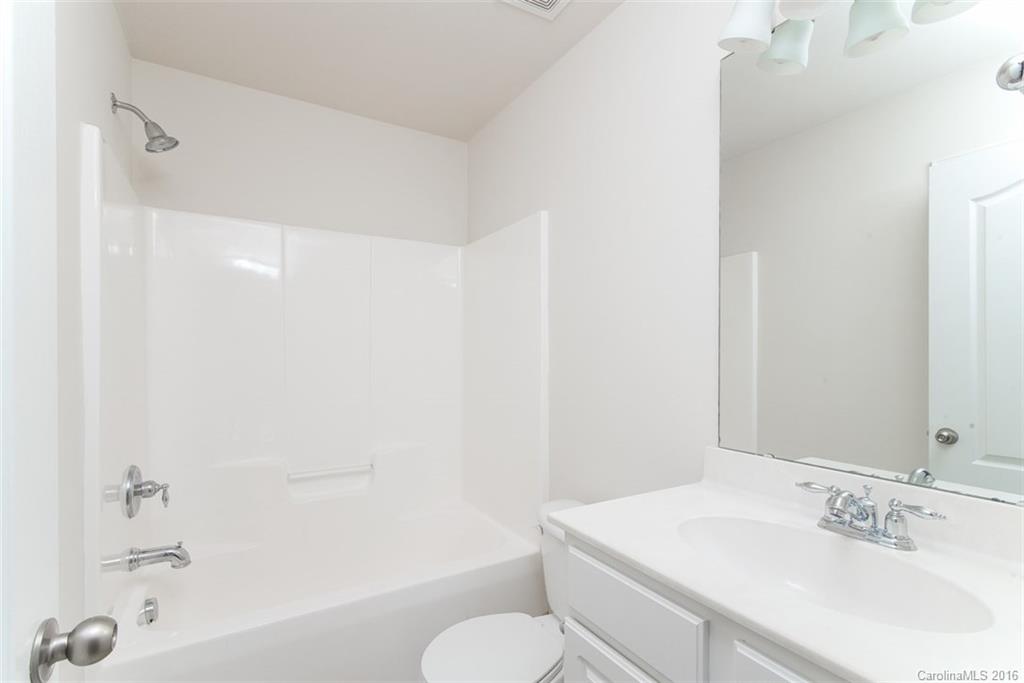 2413 Coltsgate Road Waxhaw, NC 28173 - Photo 20 of 24 a bathroom with a sink toilet and shower