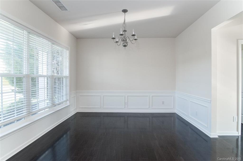 2413 Coltsgate Road Waxhaw, NC 28173 - Photo 3 of 24 wooden floor in an empty room with a window