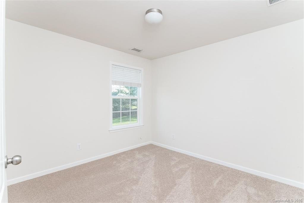 2413 Coltsgate Road Waxhaw, NC 28173 - Photo 22 of 24 a view of an empty room with a window