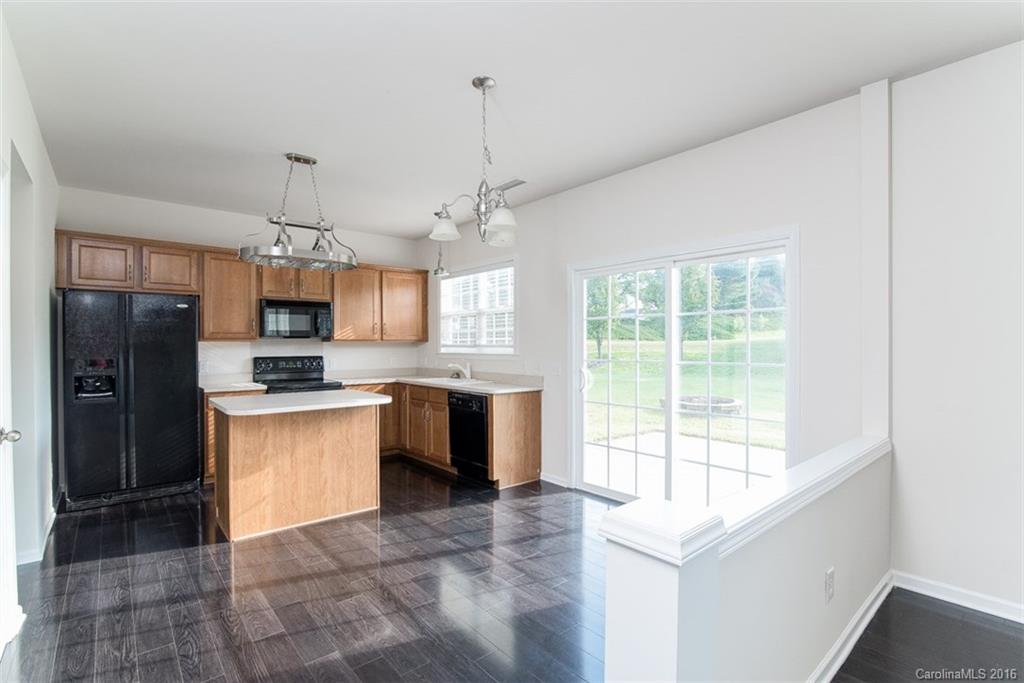 2413 Coltsgate Road Waxhaw, NC 28173 - Photo 5 of 24 a large kitchen with granite countertop a large counter top stainless steel appliances and cabinets