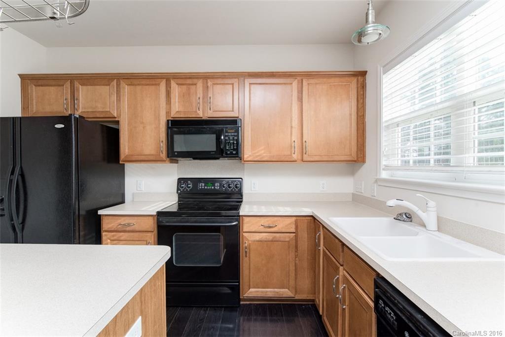 2413 Coltsgate Road Waxhaw, NC 28173 - Photo 8 of 24 a kitchen with a sink stove and microwave