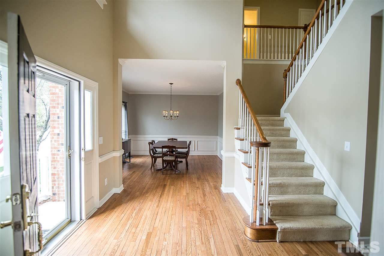 5204 Camfirth Way Raleigh, NC 27613 - Photo 5 of 21 a view of entryway and hall with wooden floor
