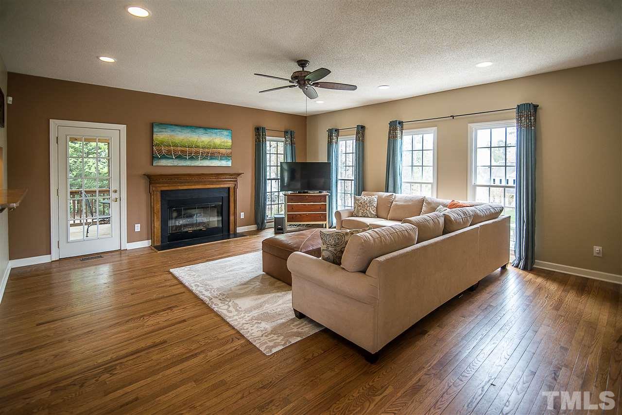 5204 Camfirth Way Raleigh, NC 27613 - Photo 8 of 21 a living room with furniture and a fireplace