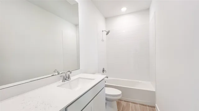 a bathroom with a sink toilet a mirror and shower