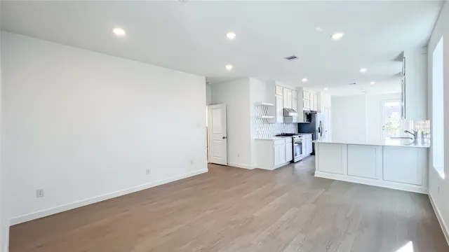 a view of kitchen with wooden floor