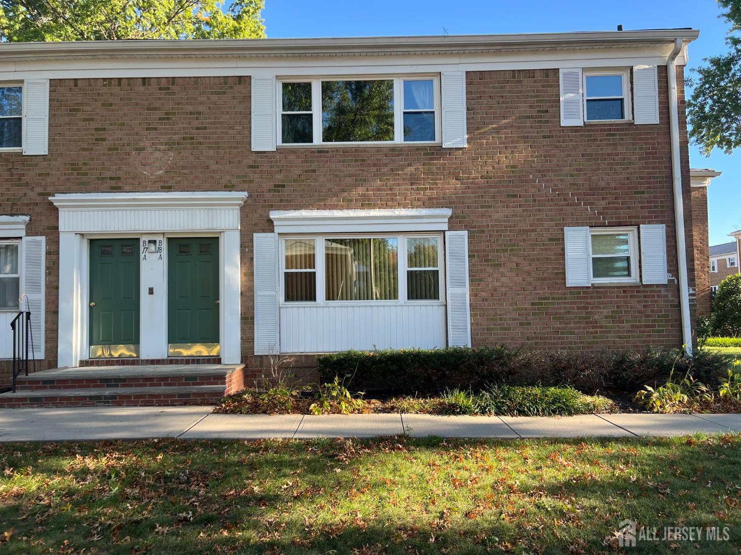 170 Evergreen Road, Unit 18A Metuchen, NJ 08840 - Photo 15 of 15 a front view of a house with a yard