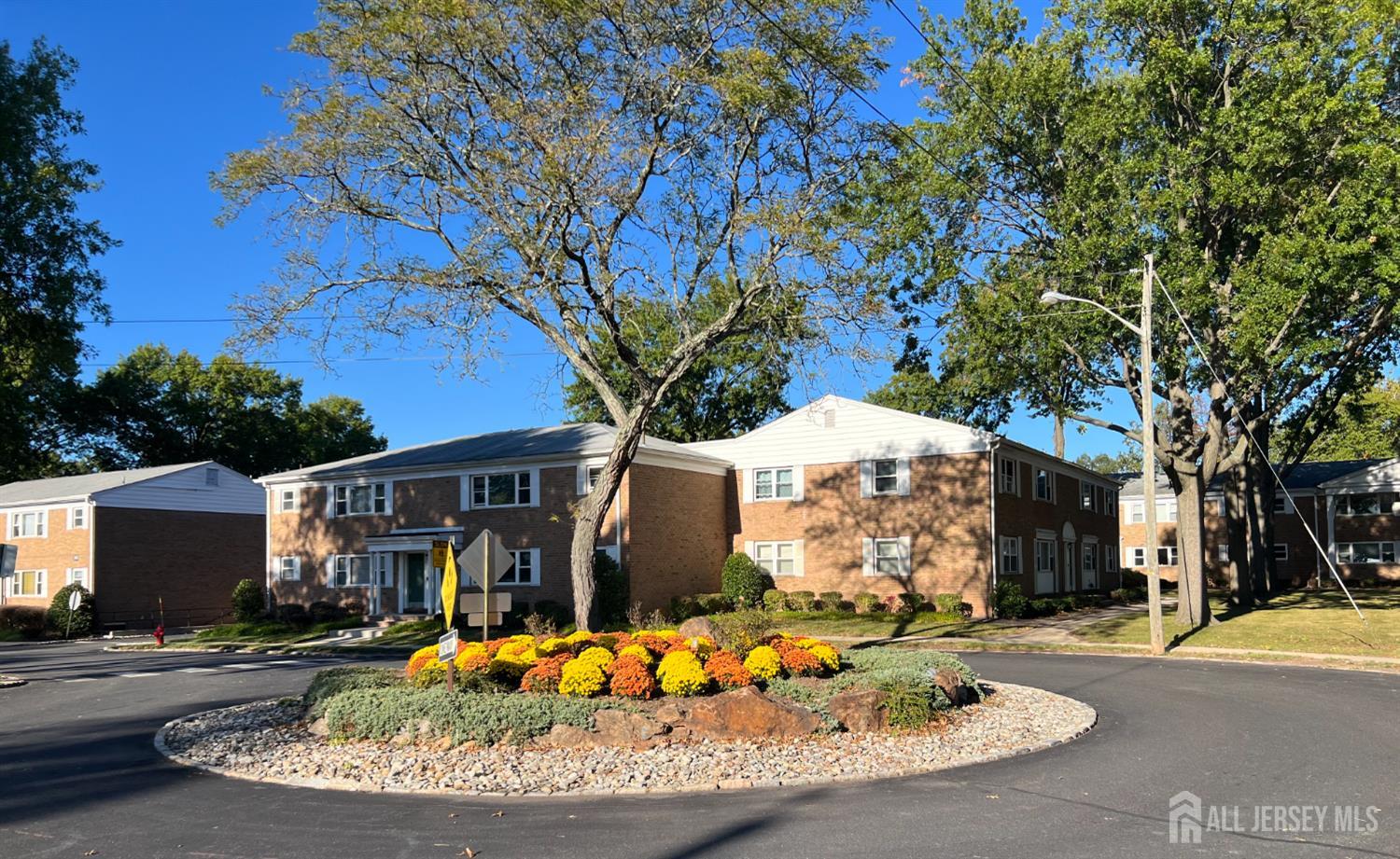 170 Evergreen Road, Unit 18A Metuchen, NJ 08840 - Photo 2 of 15 a front view of a house with a yard