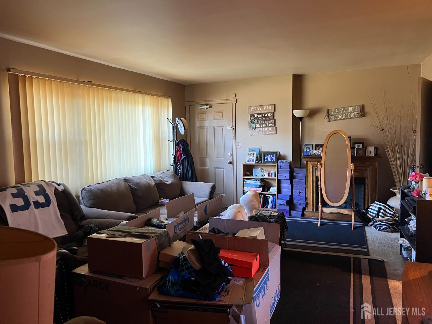 170 Evergreen Road, Unit 18A Metuchen, NJ 08840 - Photo 5 of 15 a living room with furniture a rug and a window