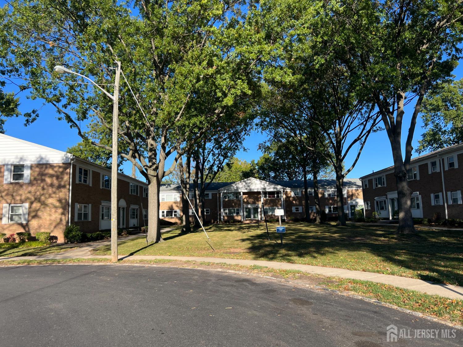 170 Evergreen Road, Unit 18A Metuchen, NJ 08840 - Photo 9 of 15 a view of a building with trees
