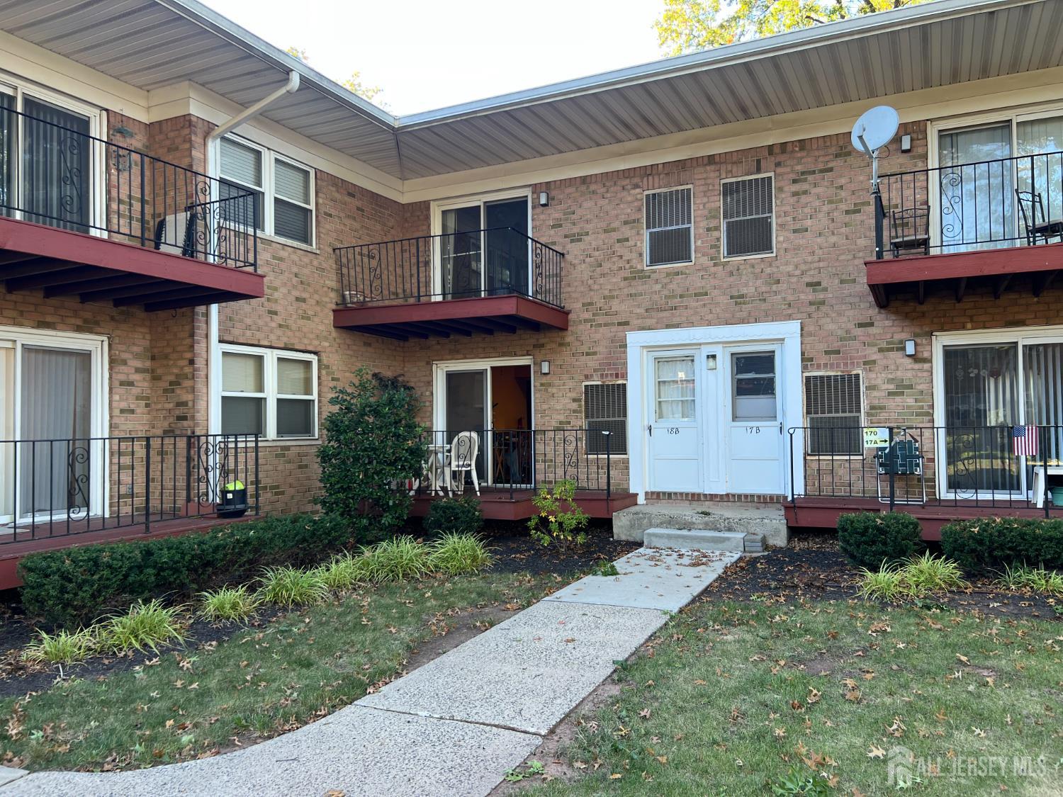 170 Evergreen Road, Unit 18A Metuchen, NJ 08840 - Photo 10 of 15 a front view of a house with garden